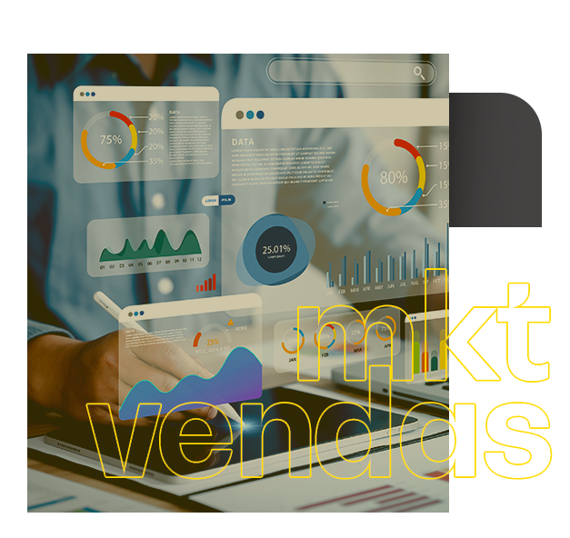 Um homem está sentado em uma mesa olhando gráficos e tabelas. Integração marketing e vendas